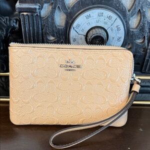 Coach Beige single zip Signature Embossed Wristlet wallet